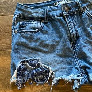 Rewash distressed with blue lace peek a boo hemline